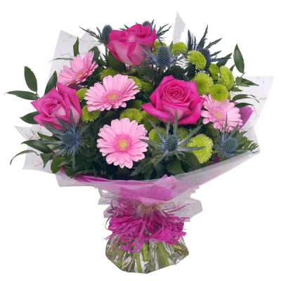 Classic Pinks - Hand tied bouquet in classic pinks. Including classic roses, pretty gerbera, vibrant chrysanthemum and spiky thistle. Expertly designed using the finest fresh flowers. Beautifully presented gift wrapped in water.