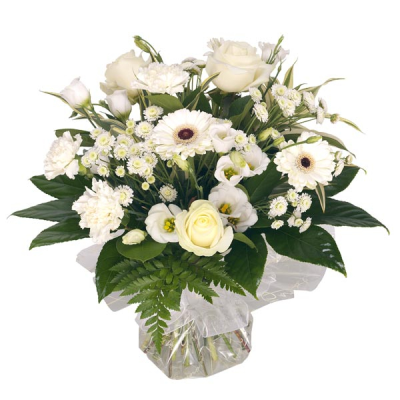 Pure - Hand tied bouquet in mixed white seasonal flowers.